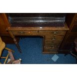 A MID 20TH CENTURY OAK DESK, with single long and three short drawers, approximate size width 92cm x