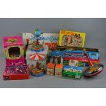 A COLLECTION OF BOXED AND UNBOXED TINPLATE CLOCKWORK TOYS, mainly of West German, Russian and