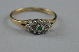 A 9CT EMERALD AND DIAMOND RING, size k, approximate weight 1.5 grams