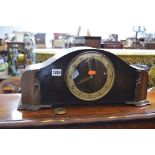 AN OAK CASED MANTLE CLOCK (pendulum)