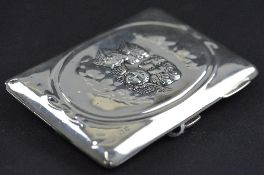 AN EDWARDIAN SILVER RECTANGULR NOTE CASE, repousse decorated with Reynold's Angels within an oval,