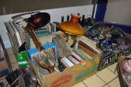 FOUR BOXES AND LOOSE SUNDRY ITEMS, to include ice skates, records, books, oil lamp, barometer, c.d'