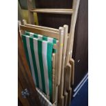 TWO VINTAGE FOLDING DECK CHAIRS WITH STOOLS, and two other vintage deck chairs (6)