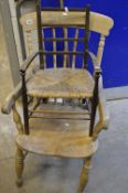 A PERIOD OAK AND ELM SPINDLE BACK WINDSOR ARMCHAIR, rushed seat, child's chair, woollen rug, red