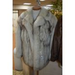 A SHORT WHITE FOX FUR JACKET