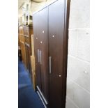 A MODERN THREE DOOR WARDROBE, above four various drawers