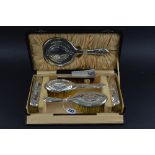 A SIX PIECE CASED SILVER BRUSH SET, c1928