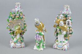 A PAIR OF CONTINENTAL PORCELAIN CANDLESTICKS, depicting a pair of birds perched on a branch and a
