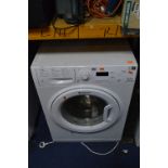 A SLIM HOTPOINT WMSEF 621 SHALLOW WASHING MACHINE, approximate depth 42cm and a microwave (2)