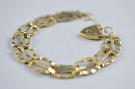 A 9CT GATE BRACELET approximate weight 11.3 grams with lock