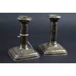 A PAIR OF SILVER DWARF CANDLESTICKS