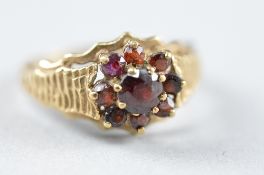 A 9CT GARNET CLUSTER RING, ring size Q, approximate weight 3.6 grams