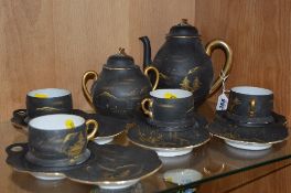 ORIENTAL EGGSHELL PART TEASET, gilt scenes on black ground, to include teapot, covered sugar and