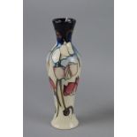 A MOORCROFT POTTERY VASE, 'Wild Cyclamen' pattern, impressed backstamp and painted '2001' to base,