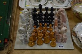 A SOAPSTONE CHESS SET AND BOARD, together with Stanton chess set (rubbed)