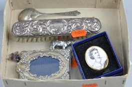 A BOX OF MISCELLANEOUS, to include silver picture frame, hair brush, spoon, etc