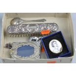 A BOX OF MISCELLANEOUS, to include silver picture frame, hair brush, spoon, etc