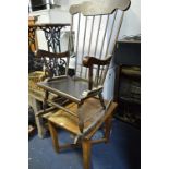 AN OAK OCCASIONAL TABLE, on a cross stretchered base and an oak rocking chair (2)