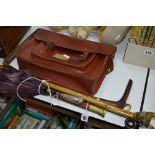 A WHITE METAL TOPPED UMBRELLA, three walking sticks and a girls satchel (5)