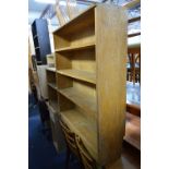 A LIGHT OAK SIDE BY SIDE OPEN BOOKCASE, a Victorian D-end table and a Stag dressing table (3) (