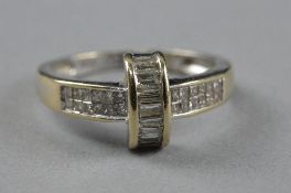 AN 18CT DIAMOND RING, set with a row of baguette cut diamonds crossing a row of twenty set diamonds,