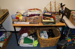 FOUR BOXES/WICKER BASKET OF SUNDRY ITEMS, to include model ship, Christmas items, balls of wool,