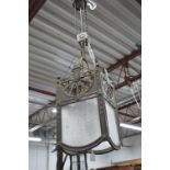 A FRENCH BRASS ART DECO CENTRE HANGING LIGHT FITTING, of a square form with textured frosted panels,