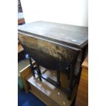 AN OAK BARLEY TWIST DROP LEAF TABLE, a teak sewing box, mirror and a linen box (4)