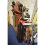 THREE VARIOUS VINTAGE GOLF BAGS, with clubs and a trolley