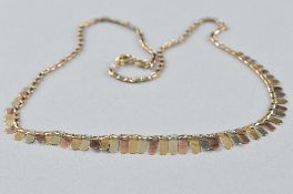 A 9CT 3 TONED GOLD FRINGE NECKLETT, approximate length 42cm, approximate weight 5.6 grams
