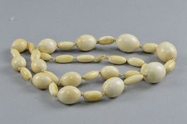 A LATE VICTORIAN CARVED IVORY BEAD NECKLACE