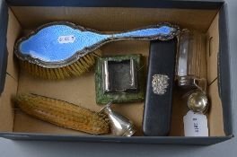 A BOX OF DISTRESSED SILVER, to include enamelled hairbrush, two brushes, etc