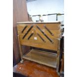 AN OAK CANTILEVER SEWING BOX ON WHEELS, brassed uplighter and three table lamps (5)