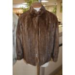 A SHORT BROWN FUR JACKET