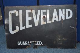 A DISTRESSED ENAMEL ADVERTISING SIGN, Cleveland (Petrol) Guaranteed, white lettering on black