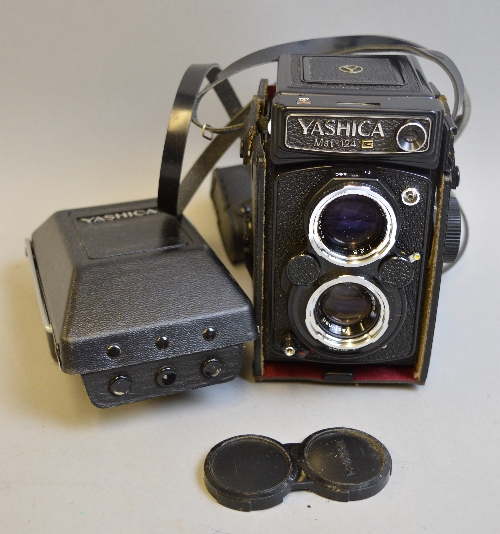 A YASHICA MAT-124G TWIN LENS REFLEX CAMERA, in leather case and fitted with a 80mm 1:2.8 lens