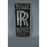 A CAST ALUMINIUM ROLLS ROYCE WALL MOUNTED SIGN, enamelled black background with raised aluminium