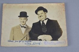 A LAUREL & HARDY PHOTOGRAPH, signed by Stan Laurel with the greeting '
