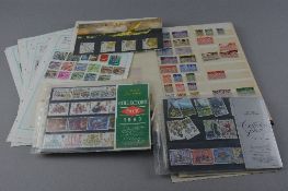 AN ACCUMULATION OF STAMPS IN THREE ALBUMS, a stockbook on leaves and loose