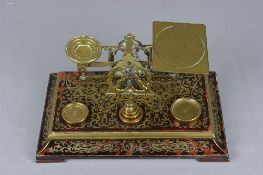 A SET OF VICTORIAN S. MORDAN & CO DESK POSTAGE SCALES, the boulle marquetry base fitted with six