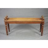 A VICTORIAN MAHOGANY RECTANGULAR WINDOW SEAT, with canted corners, raised cylindrical seat ends,