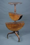 AN EARLY 19TH CENTURY MAHOGANY THREE TIER DUMB WAITER, graduated drop leaf design, baluster turned
