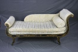A REGENCY EBONISED AND PAINTED DAY BED, scrolled end frame on four outward swept legs with brass