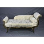 A REGENCY EBONISED AND PAINTED DAY BED, scrolled end frame on four outward swept legs with brass