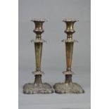 A PAIR OF EDWARDIAN SILVER CANDLESTICKS, foliate cast decoration to removable sconce, shoulders