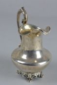 AN EARLY VICTORIAN SILVER CREAM JUG, of baluster form, cast 'S' scroll handle, engraved initials