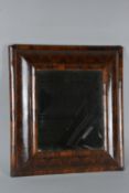 A WILLIAM & MARY WALNUT OYSTER VENEER CUSHION FRAMED MIRROR, later bevel edged plate, plate size