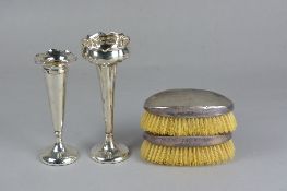 A PAIR OF GEORGE V OVAL SILVER BACKED DRESSING TABLE BRUSHES, engine turned, makers Charles S. Green