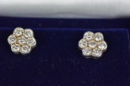 A MODERN PAIR OF DIAMOND DAISY STYLE CLUSTER EARRINGS, post and scroll fittings, estimated modern