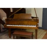 A YAMAHA G 3 6 FOOT GRAND PIANO, Serial No.E1923359, finished in a golden brown, made in